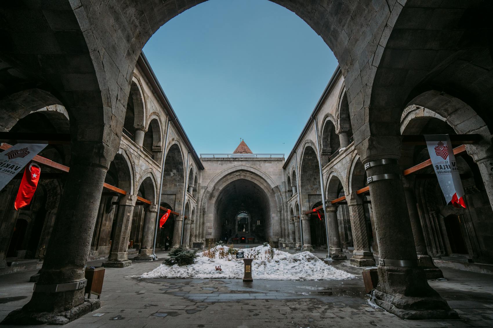 Historic stone interior with arches and quiet architectural rhythm.